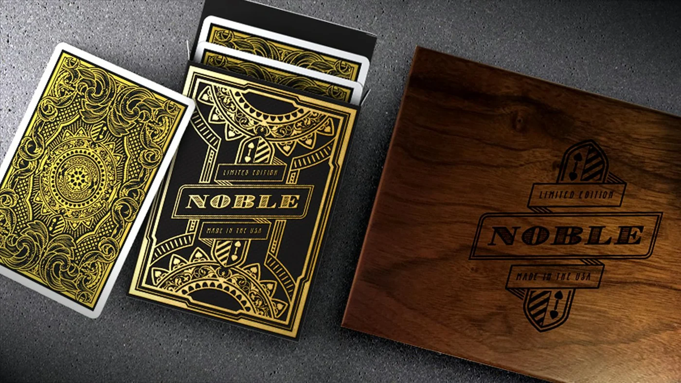 Noble deck with gold foil card backs and an engraved walnut presentation box