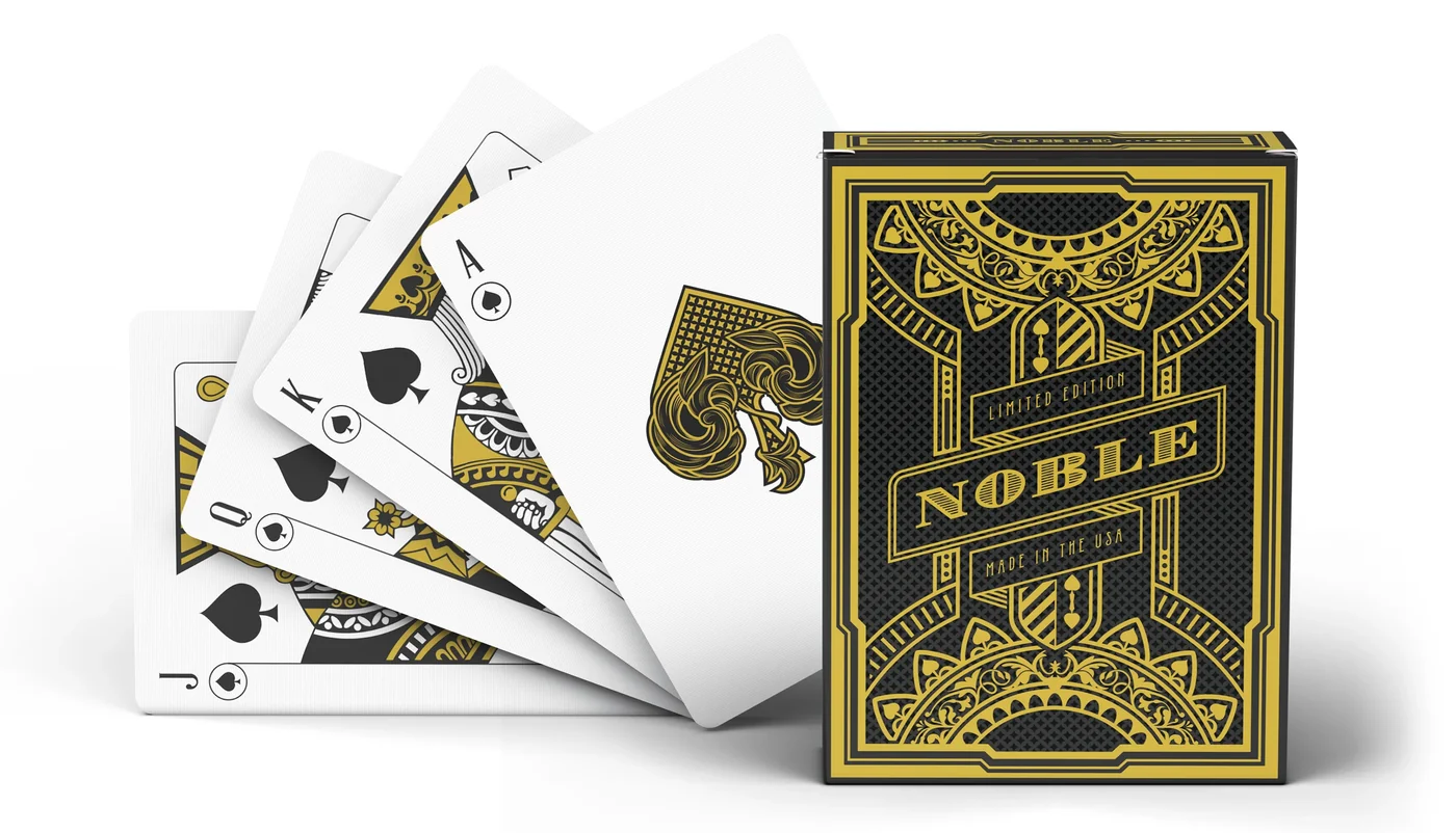 Noble limited edition playing cards, face cards fanned beside the tuck box